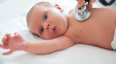 baby being examined by a fayetteville nc pediatrician at rainbow pediatrics